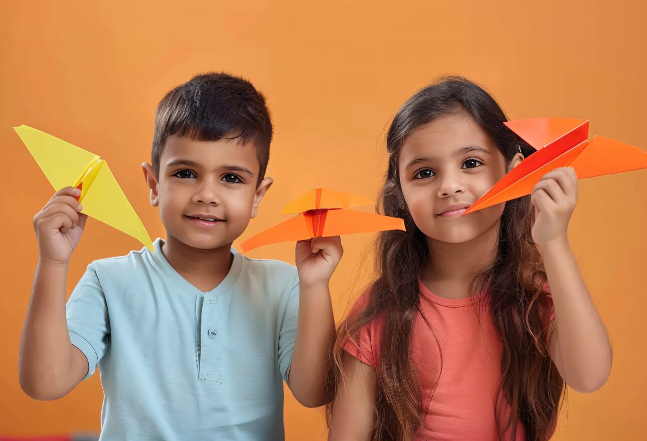 kids playing with paper plane