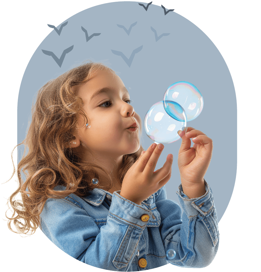 girl blowing bubbles