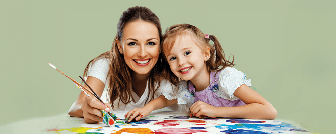 therapist and girl painting together