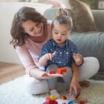 mother and daughter playing with toys