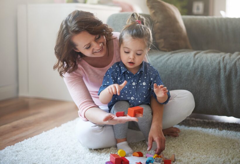 mother and daughter playing with toys